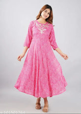 Rayon Lahariya printed striped pink gown with three-quarter sleeves, Indian traditional women's fashion on mannequin